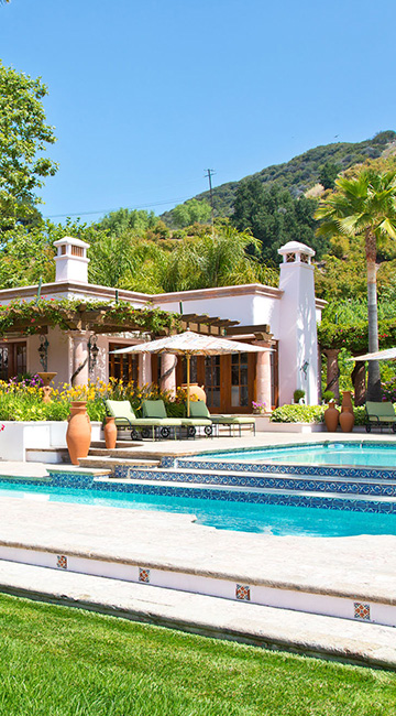Main house at the Rosenthal Estate with swimming pool and palm trees